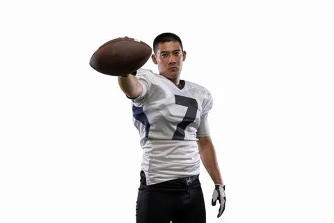 Close-up young American football player, athlete posing isolated on white studio Stock Photos