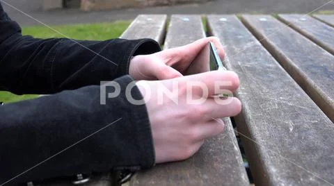 Close up of young anonymous female on smart phone Stock Photos