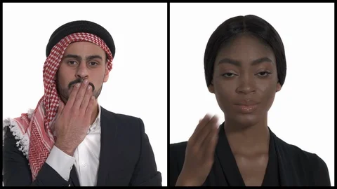 Close-up of a young Arab man and African woman folding lips and holding palms to Stock Footage 129393177