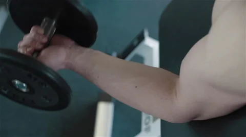 Close-up of a young athletes arm exercising with weights Stock Footage 49161850