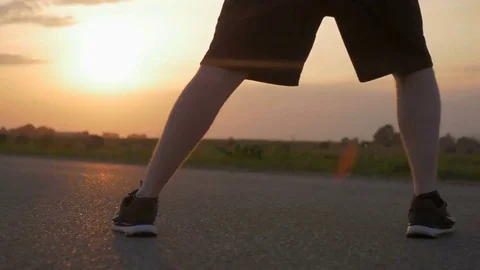 Close-up of young athletic man warming up before sport activity. Video stock 82234213
