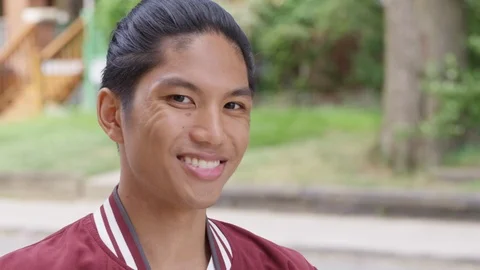 Close up - Young attractive man with braces smiles into the camera. - Slow Stock Footage 125167914
