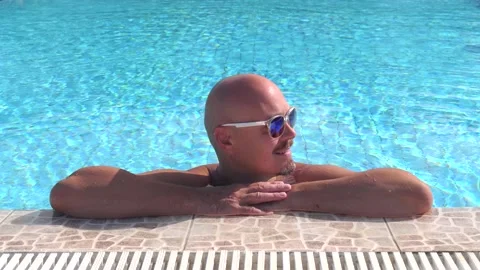 Close-up young bald Caucasian model man in sunglasses Stock Footage 132664722