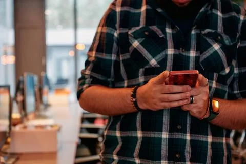 Close Up Young Bearded Programmer Using Smartphone in Office Stock Photos