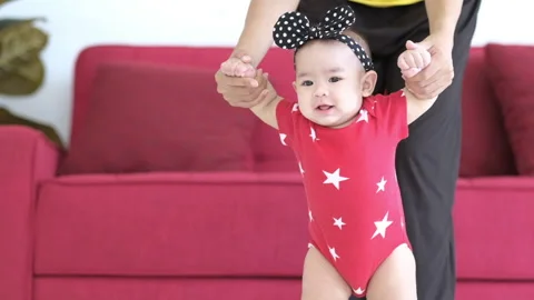 Close up of young biracial mom hold little infant toddler learn walking 스톡 동영상 139655244