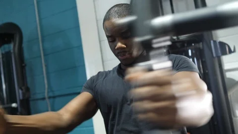 Close Up Of Young Black Athlete Using Pec Deck Fly Machine 4K Stock Footage 98687438
