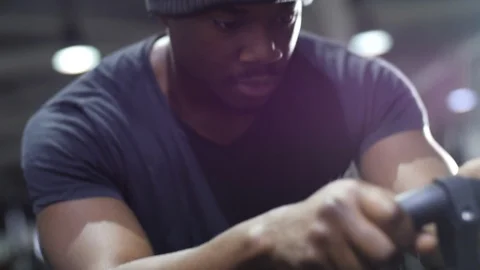 Close Up Of Young Black Athlete Using Exercise Bike at Gym 4K Stock Footage 98729314