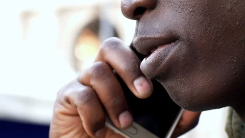 Close up on young black man talking by phone Stock Footage 88548602