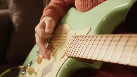 Close Up of Young Boy Playing Electric Guitar in Sunlight Stock Footage 333426100