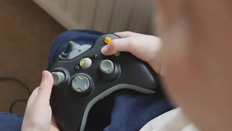 Close up of young boy playing video games Vídeo Stock 130266237