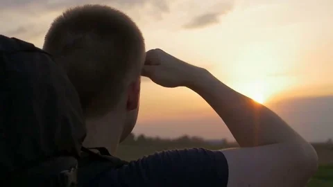 Close-up of young brave man with a backpack looking at the distance. 스톡 동영상 82234509