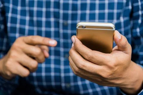 Close up young business man using on cell phone. Stock Photos