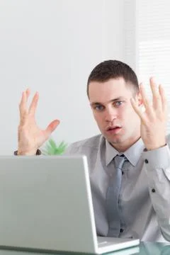 Close up of young businessman having problems with his notebook Stock-Fotos