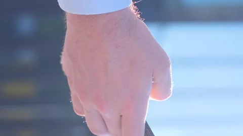 Close-up of a young businessman using a smartphone against the background of a Stock Footage 250028829