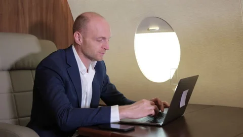 Close Up of a Young Businessman Working Using a Computer Laptop Stock Footage 135592869