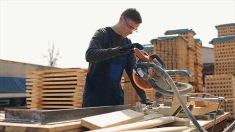 Close up of a young carpenter worker wearing construction goggles and uniform Vídeo Stock 112182925