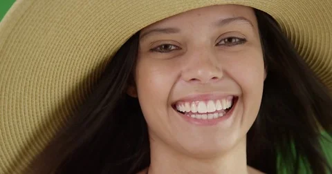 Close up of young Caucasian female poses with sun hat on a Chroma key Stock Footage