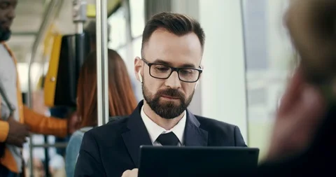 Close up of the young Caucasian good looking businessman in glasses going home Stock Footage 117748943