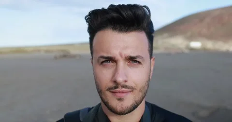 Close up of young caucasian man looking serious in camera Stock Footage 149115596