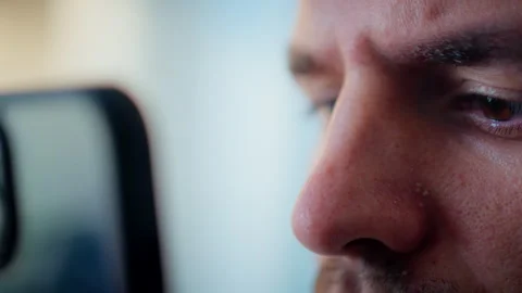 Close of a young caucasian man looking at cell phone so close Stock Footage 317837436