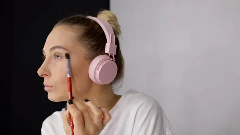 Close up young caucasian model applying eye shadow professional makeup Stock Footage 112658319