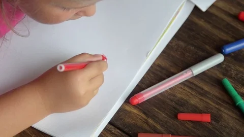 Close up of a young childs hand coloring. Stock Footage 72912287