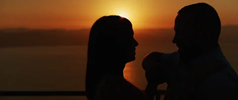 Close up of a young couple dancing and having fun at sunset, spending a roman Stock Footage 136246238