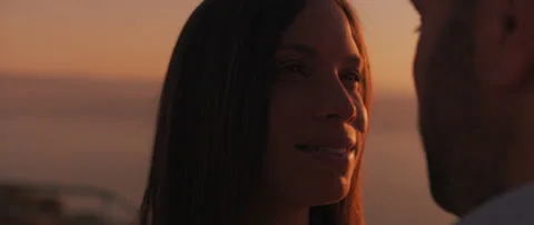 Close up of a young couple looking at each other with love at sunset, with be Stock Footage 136244492