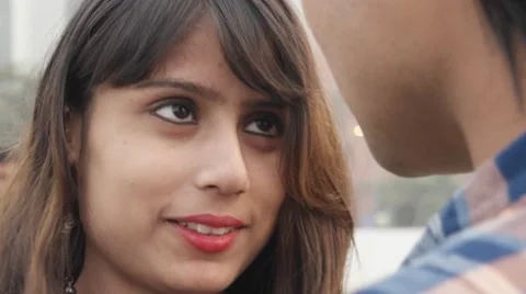 Close up of young couple talking smiling and in love in public park Stock Footage 59516451