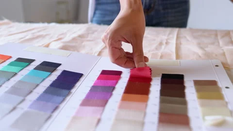 Close up of a young creative designer looking at color book sample. Stock Footage 130595220