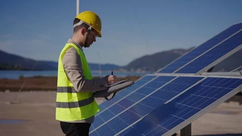 Close up of young engineer hand is checking the operation of sun and cleanliness Stock Footage 240519764