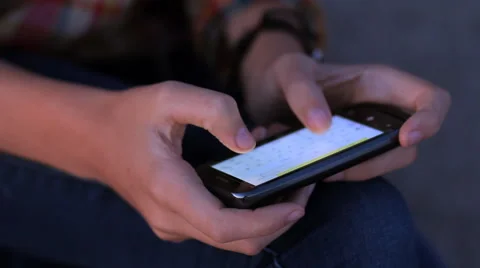 Close-up young female hands text messaging on smart phone Stock Footage 65799059
