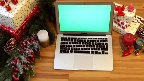 Close-up of young female hands using modern laptop keyboard with blank green Видео 146368295