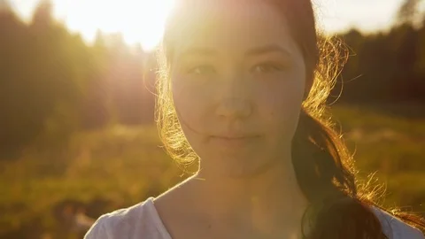 Close-up of a young female looking at the camera. Stock Footage 77037859