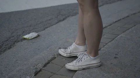 Close up Young Female's legs waiting at crosswalk Stock Footage 85636853