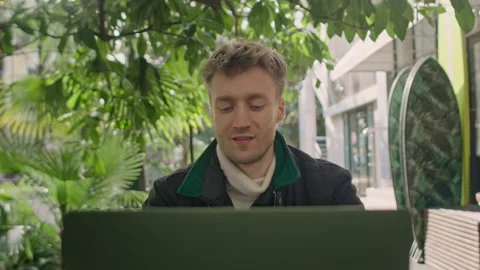Close up of young freelancer typing on notebook in the cafe writing notes. Stock Footage 150727072
