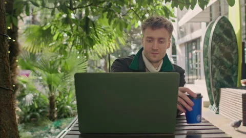 Close up of young freelancer typing on notebook in the cafe writing notes. Stock Footage 150727381