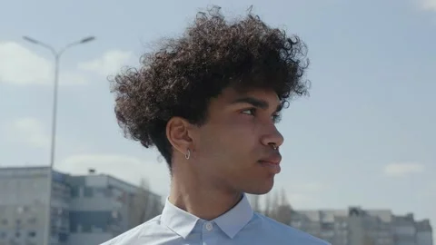 Close up young fun african man curly hair 20s years old wears blue white shirt Stock Footage 155616394