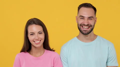 Close up young fun couple friends bearded man woman in basic t-shirts isolated Stock Footage 148322751
