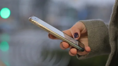 Close up of a young girl hands using a cellphone. Video stock 85483722