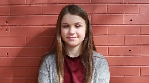 Close up of young girl looking into camera, video Stock Footage 61513391