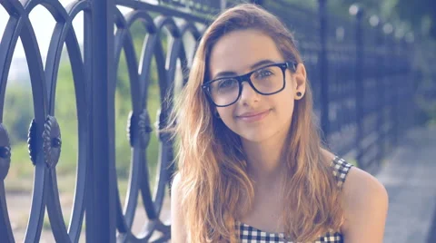 Close up of young girl looking to camera. Stock Footage 64382175