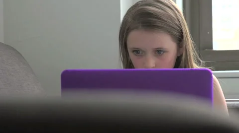 A close-up of a young girl using a laptop Stock-Footage 44116992