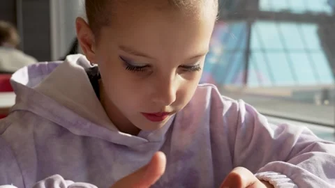 Close-up of a young girl using a smartphone screen. Modern technology, chil.. Stock Footage 306445557