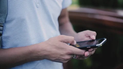 Close up of the young guy uses his phone Stock Footage 67407956