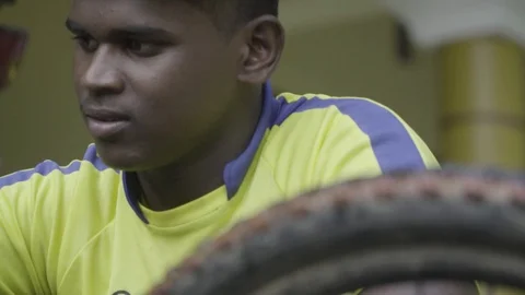 Close up of young guy washing cycle with water slow motion bicycle  Video stock 129928327