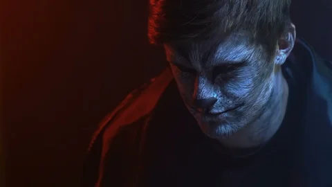 Close-up, Young Guy with Wolf Pattern on Face Immortal Grin Stock Footage 88450592