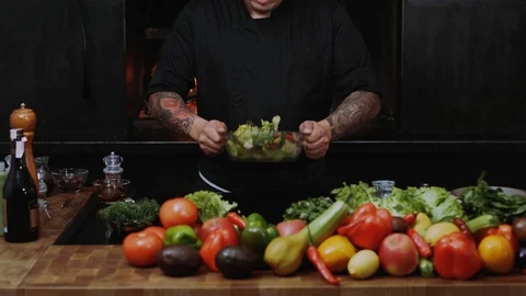 Close up young hand chefs at work in a restaurant kitchen cooking salad culinary Stock Footage 100303518