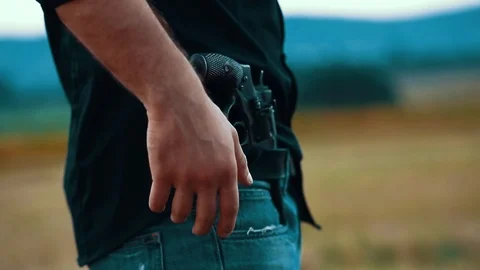 Close up young hands cowboy with guns shoots killed murder vintage west wild Stock Footage 121065255