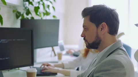 Close Up of Young Handsome IT Programmer Using to Programming Code in Control Stock Footage 245226627